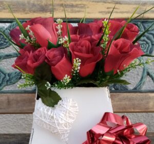 Red-silk-roses-in-white-container